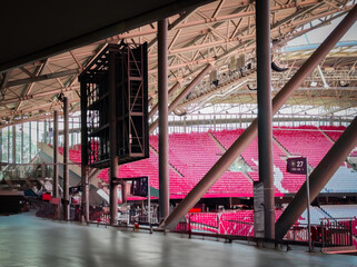 View into the stadium with visible tech – speakers, lighting, and steel beams under the stadium...