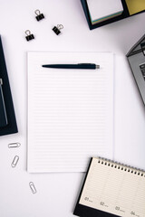 Top view of office table with laptop, pen, nootbook and stationery in home office room, clipping path. Desktop mock up.
