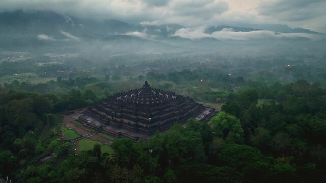 Aerial view of Borobudur Temple on a cloudy, foggy day after rain.