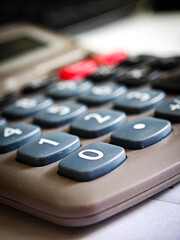 Close-up of a calculator with focus on the number 2 key &ndash; everyday technology.