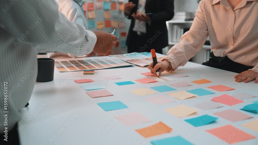 Aufkleber a diverse group of professionals engages in dynamic brainstorming, using colorful sticky notes on a 