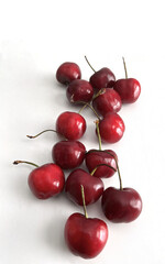 Fresh red cherries on white background with copy space above