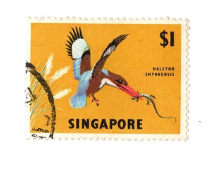A vintage postage stamp from Singapore isolated on a white background.