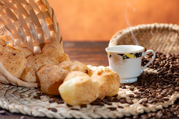 Cheese bread and coffee, delicious Brazilian cheese bread and a beautiful cup of coffee on a rustic...