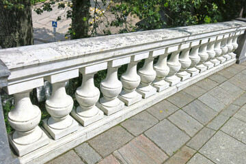 fence is made of stone white balusters