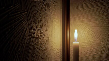 Lit candle in front of textured wall, soft light, cozy atmosphere - Powered by Adobe