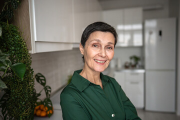 Happy mature woman toothy smiling enjoying herself. Natural appearance, body positivity,...