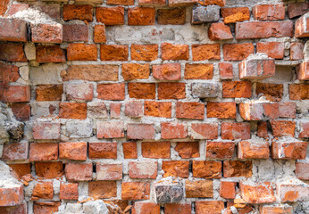Old and damaged volumetric brick wall background with dropped out bricks. Seem 3D.