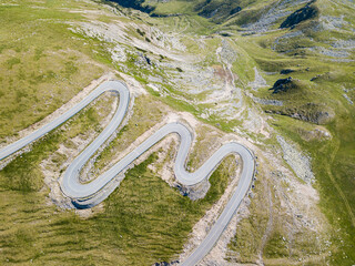 Aerial view of the spectacular Transalpina road with many serpentines crossing the Carpathian mountains at high altitude