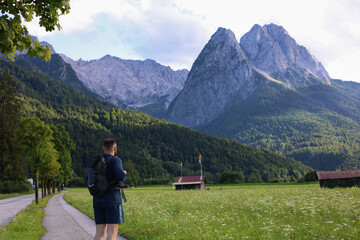 A man is going on a hiking trip in the mountains.