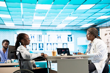 African american practitioner and girl with disability engaging in a detailed checkup, emphasizing professional care and wellness practices for disease prevention. Chronic impairment.
