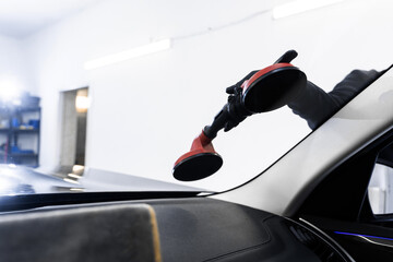 Windshield replacement using lifting tools that grip glass securely. Windshield technicians rely on...