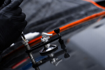 Resin repair on windshield using injector application to restore structural clarity. Windshield...