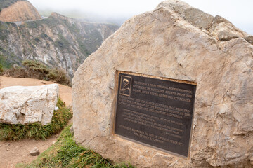 Detailed side angle of a commemorative bronze plaque near Bixby Bridge, honoring California’s...