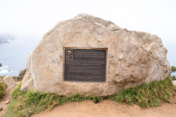 Detailed side angle of a commemorative bronze plaque near Bixby Bridge, honoring California’s...