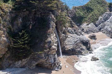 Closer view of McWay Falls where the freshwater stream drops directly onto the beach sand...