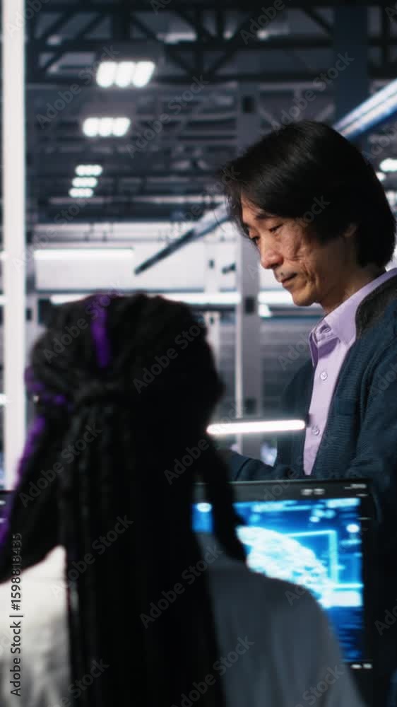 Poster vertical video data center manager supervising developer using device to monitor neural network ai l