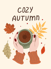 Warm hands hold a mug of coffee surrounded by autumn leaves in a cozy setting