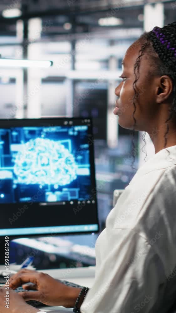 Poster vertical video female programmer in data center reviews ai diagnostics, analyzing neural network per
