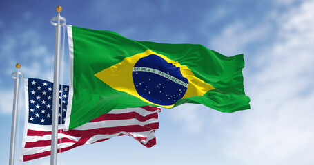 Brazil and USA flags waving. Symbol of partnership, trade and cooperation