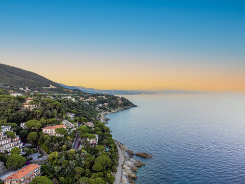 Panoramic aerial view of Varazze, Liguria region, province of Savona, Italy. A beautiful view of the coast surrounded by green hills l Beigua regional natural park, UNESCO geopark. 