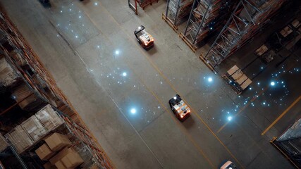 Innovative technology guides automated guided vehicles - agvs - carrying goods through a modern warehouse, optimizing logistics and efficiency with automated transport systems