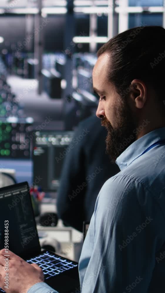 Poster vertical video server room technician using ai llm chatbot to review infrastructure diagnostics. it 