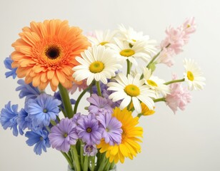 Colorful floral arrangement featuring orange gerbera daisies, white daisies, blue hyacinths, purple asters, pink hyacinths. Hope, new beginnings, spring. Fresh garden blooms create vibrant natural
