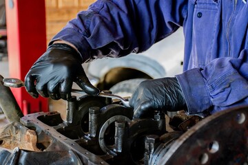 mechanical workshop
man  working on an engine