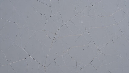 A closeup view of a light gray textured surface with subtle, intricate dark lines resembling cracks or veins, offering a minimalist and modern abstract background