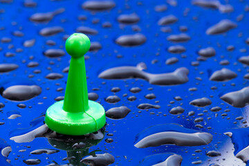 Green board game chip - Blue background