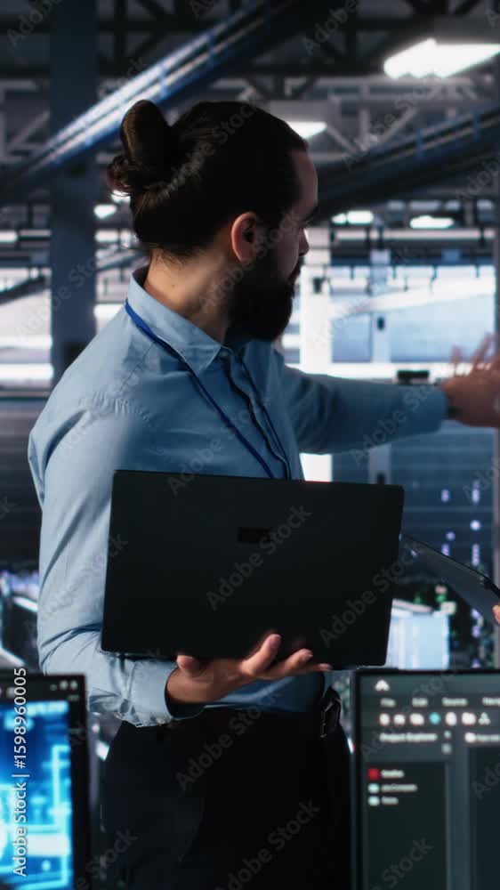 Aufkleber vertical video data center manager supervising work done by programmers working on neural network so