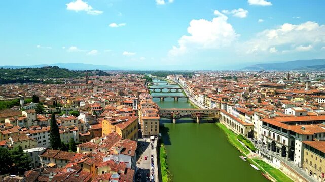 The Ponte Vecchio is a medieval stone closed-spandrel segmental arch bridge over the Arno, in Florence, Italy. 4K, high quality.