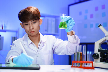 Scientist recording the results of the study in a laboratory journal.