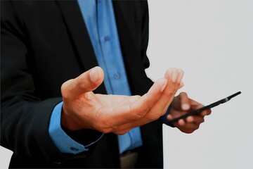 Closeup of a business man's hand with his left hand holding a cell phone and his right hand open.