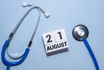 Wooden block calendar with the date August 21