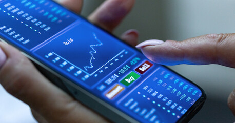 Woman buys shares online on her smartphone, prices, stock market information. Internet trading, brokerage, investment, risk, success, business.