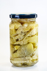 Preserved artichoke hearts packed in glass jar maintaining freshness