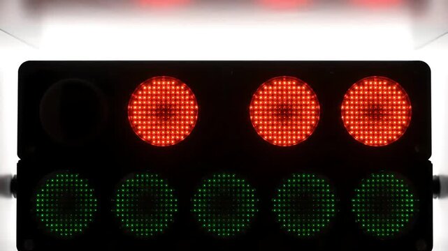 Dynamic racing start lights vibrant red green LED signals dark background for track events tech themes countdowns and futuristic visuals