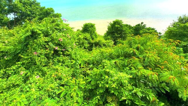 Beautiful view from Kao Khad next to Cape Panwa on the island of Phuket Thailand. Views of the turquoise Blue waters of the Andaman Sea and small islands off the coat of Phuket