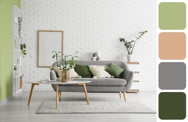 Interior of stylish light living room with sofa and table. Different color patterns