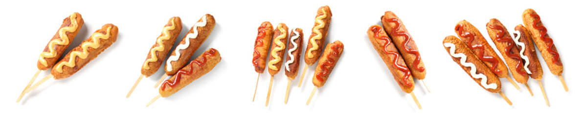 Set of tasty corn dogs on white background