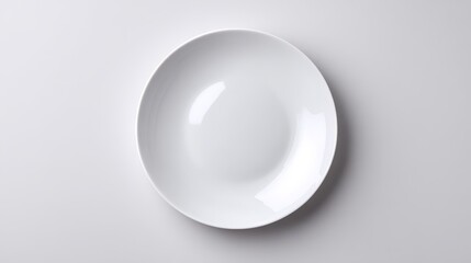 Empty white plate on a neutral grey background, minimalist culinary canvas for food photography and design inspiration