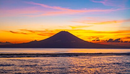 Volcanic sunset over calm water