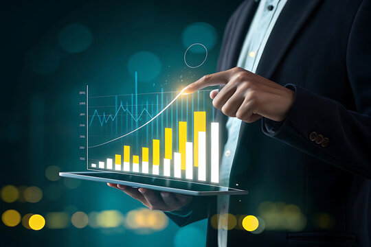 Businessman analyzing financial growth chart on a tablet with glowing data visualization