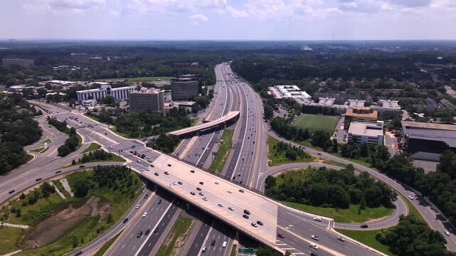 Drone view of Expressway in Virginia. traveling on interstate 495. Complex traffic infrastructure in Tysons, VA.
