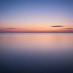 Naklejka premium Peaceful Sunset Over Calm Ocean Water