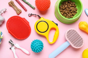 Food bowl and different pet accessories on pink background