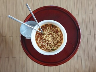 Instant Korean Cup Noodles with Chopsticks and Broth