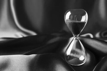Crystal hourglass on dark  background